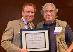 Asa Aarons, former consumer reporter for WCBS-TV, NY1 News, WNBC-TV and founder and co-creator of JustAskAsa website, presents Benedict Fernandez ’87, with the Citizen Laureate Award.