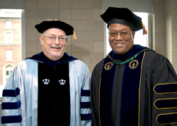 Empire State College faculty members Robert Carey, at left, and David Fullard seen at the 2013 Metropolitan Center graduation, are among the driving forces behind the establishment of the BMI Scholarship. (Photo/Marty Heitner)