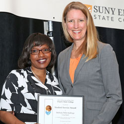 Melinda Wills-Stallings is presented with the college's student service award by President Merodie A. Hancock at the 2015 Student Wellness Retreat