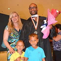 Graduate Matthew Canuteson and his wife, Lisa, with their sons, Abraham, 6, and Augustus, 4 at the reception following the 2015 commencement event held in Albany. Photo/Empire State College
