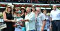 President Hancock and member's of the college's alumni and foundation boards, present the winning trophy to jockey Irad Ortiz Jr., who rode Driving Me Crazy to victory in the fourth race at Saratoga.