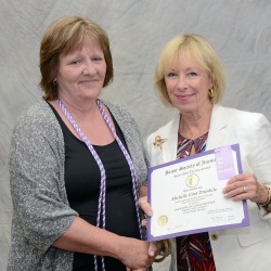 SUNY Empire nursing student Michelle Drysdale, left, is presented with her STTI certificate of induction by Barbara Pieper an associate dean at Excelsior College and one of the chapter’s counselors. Photo/Tom Stock, www.saratogaphotographer.com