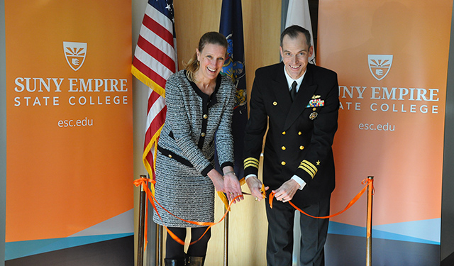 SUNY Empire State College President Merodie A. Hancock, at left, and U.S. Navy Commander Judd Krier cut a ceremonial ribbon opening the national testing center at the college.
