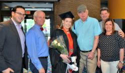 Student Speaker Claudia Parrington surrounded by her family after the Purchase commencement event.
