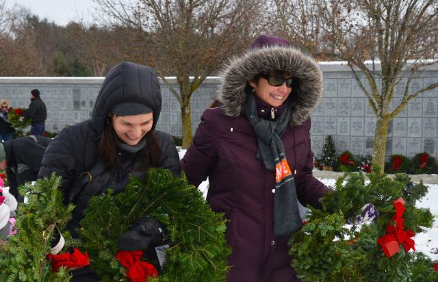SUNY Empire State College Assistant Registrar Vanessa Redfield, at left, and Susan Bruce, the college’s veteran and military services coordinator, volunteered to lay wreaths on the graves of veterans as part of Wreaths Across America.