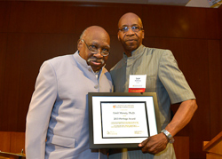 Emil Moxey, mentor emeritus at the Metropolitan New York Center is presented with the Heritage Award by Lear Matthews, a Metro Center mentor in community and human services and past recipient of the Altes Prize for Community Service.