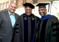 Student and BMI President Lawrence H. Johnson, at left in bow tie, joined Professor David Fullard and alumnus Jay Marshall ’06, ’08, at the 2013 Metropolitan Center graduation. Fullard, together with Johnson, Marshall and others, led the establishment of the BMI scholarship. (Photo/Marty Heitner)