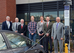 SUNY Empire State College President Merodie A. Hancock is joined by William Flaherty of National Grid, far left, Andy Balmuth of ChargePoint, Mayor Scott Johnson, Arthur Bozogian, who recharged his hybrid vehicle at the event, Mark Torpey of NYSERDA and Rep. Paul D. Tonko together as Bozogian’s vehicle re-charges at the ChargePoint EV charging station.