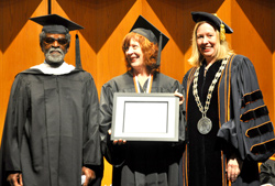Mentor Emeritus Joe Washington stands with Laurel Massé ‘05, after she received the Distinguished Alumni Award.