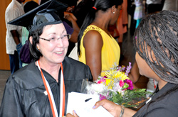 Newsday reporter Candice Norwood was on hand to interview student speaker Bernadine Bauser and several other students right after graduation.