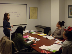 Staten Island faculty Mentor Ruth Losack meets with students in her linguistics course.