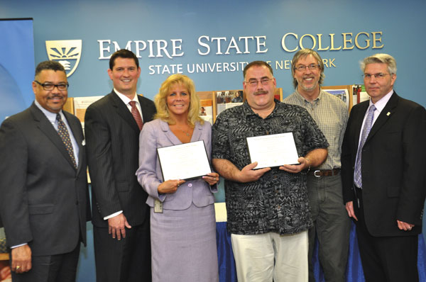 Members of the state Office of General Services took online classes to earn graduate certificates in project management. They were joined at the awards ceremony in the Plaza office by Dean Gerald Lorentz, far right, standing next to Mentor Duncan Ryan-Mann.