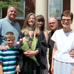 Graduate Barbara Burgett '16, surrounded by her family right after the Buffalo commencement event, was selected as a student speaker and completed her Master of Arts in Teaching. Photo/Mary-Ann Ferree  