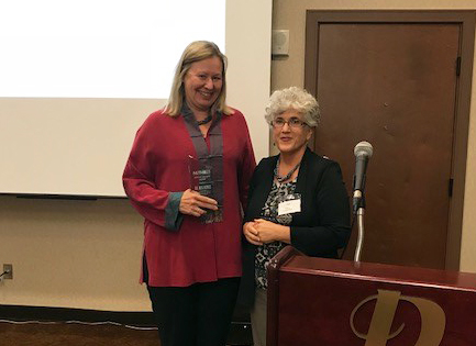 Meg Benke, left, is presented with the Noflett Williams Service Award by Deb Adair, executive director of Quality Matters, the 2016 award recipient. Photo provided NUTN