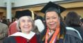 Professor Barbara Kantz, left, celebrates with Tanya Rice Thompson at the college's commencement event on Long Island. Thompson completed her master's this spring.