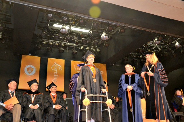 Kristina Kwacz graduates with her master's degree.